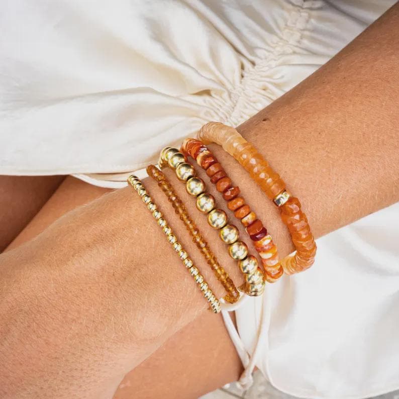Luminous Glow Peach Moonstone bracelet by Earthly Abundance featuring round peach-colored moonstone beads on an elastic band