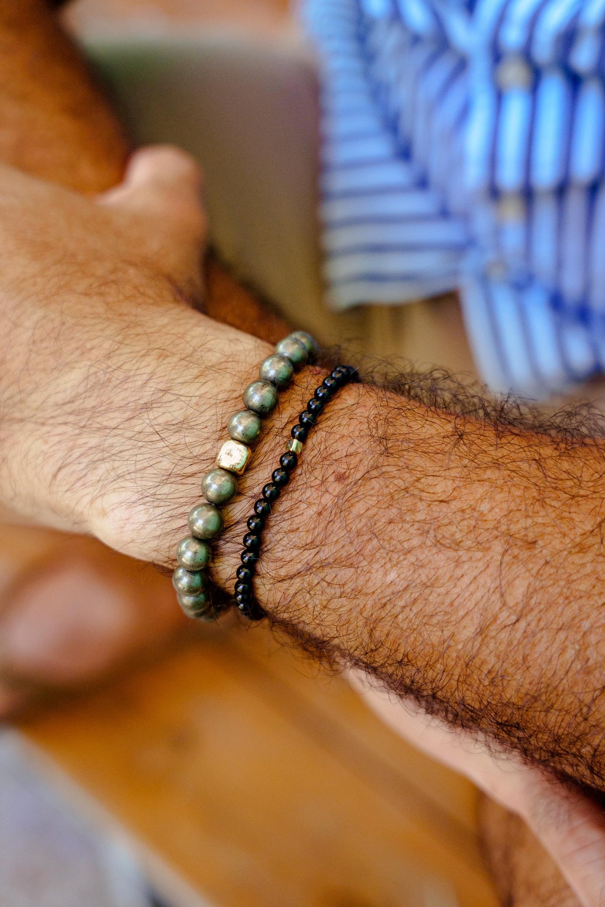 Men’s black tourmaline bracelet featuring polished black stones on an elastic band, from Earthly Abundance.