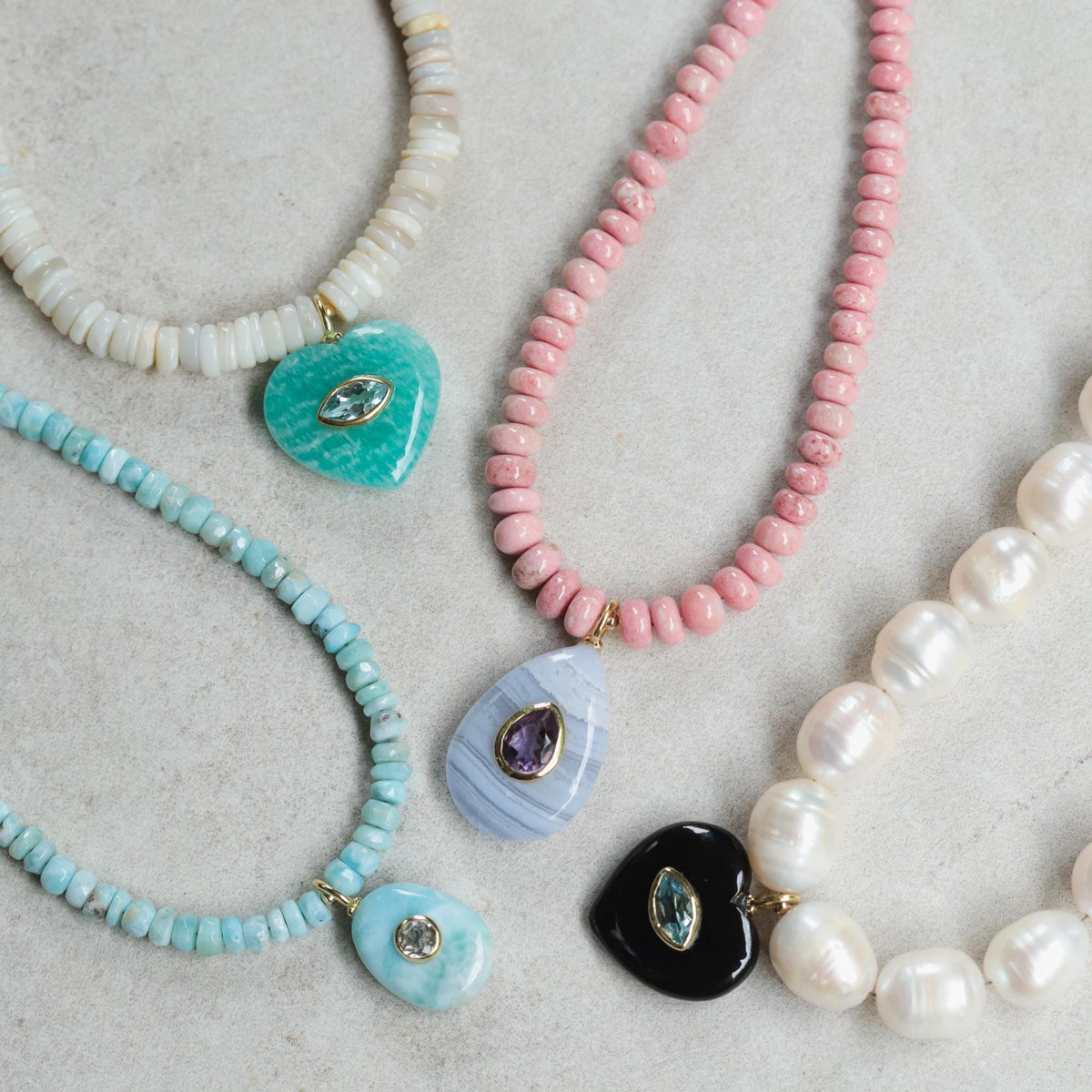 Earthly Abundance Cosmic Tide Necklace featuring Australian opal, Amazonite, and blue topaz gemstones on a silver chain.