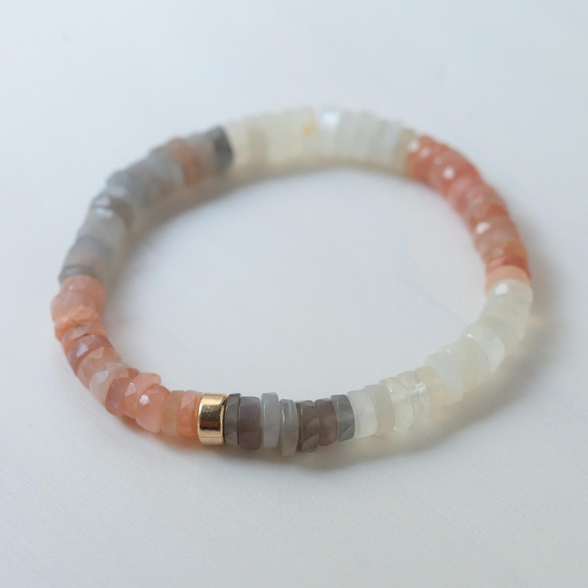 Mixed moonstone bracelet by Earthly Abundance featuring smooth, round moonstone beads in a stylish jewelry design.