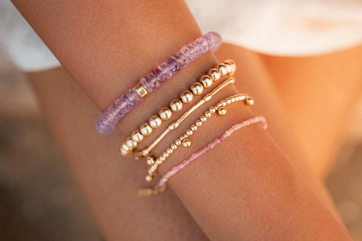 Ethereal Pink Amethyst Heishi bracelet featuring small pink amethyst beads on a delicate string, handmade by Earthly Abundance.