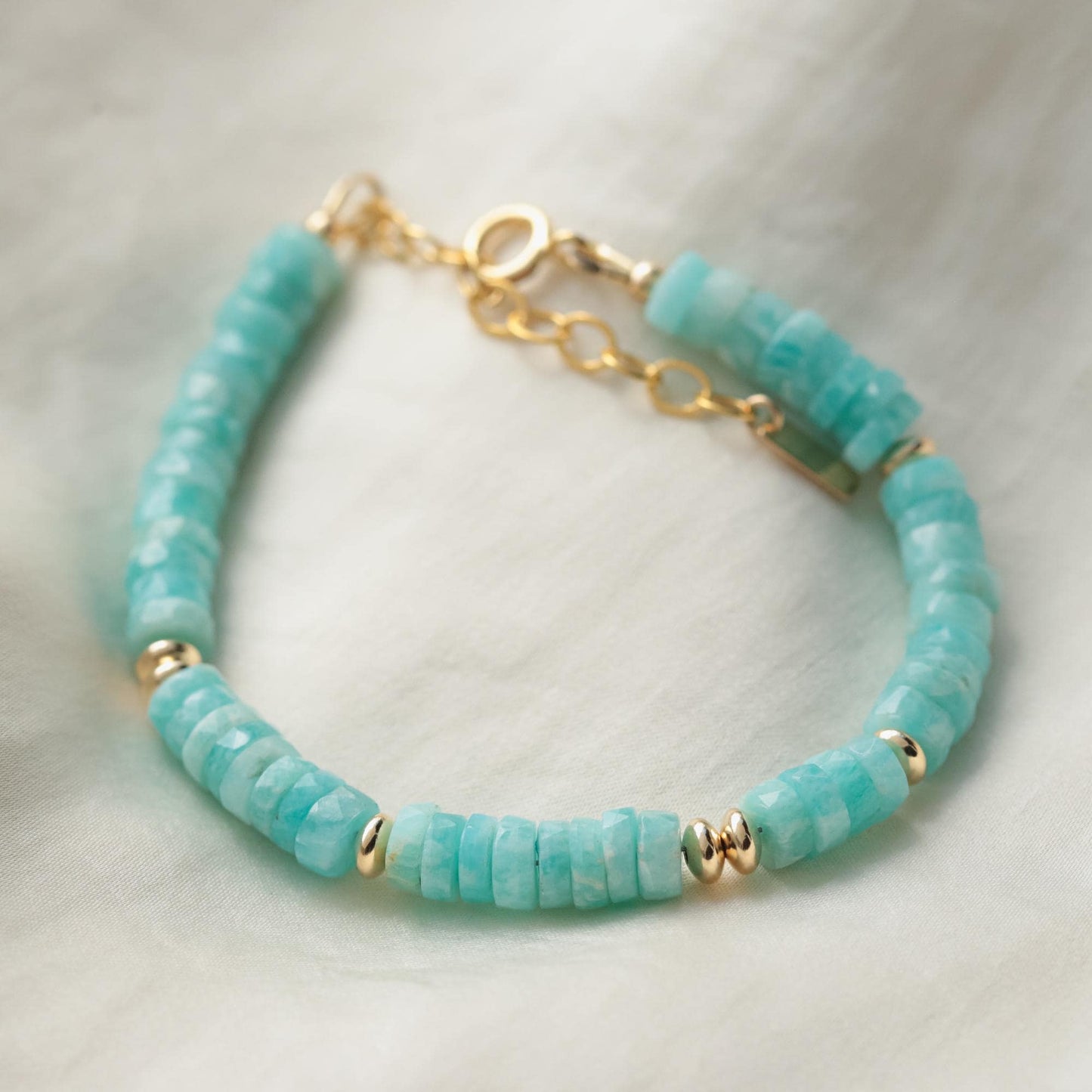 Earthly Abundance Calm Energy Amazonite Heishi bracelet featuring smooth, turquoise-blue gemstone beads on a stretch cord.