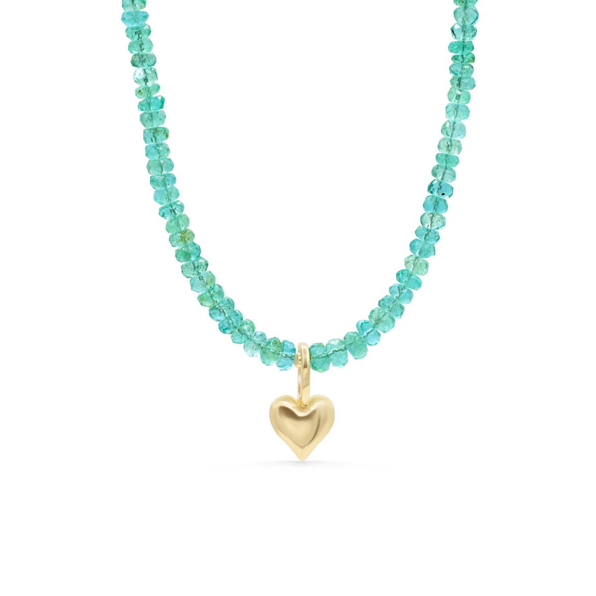 Zambian emerald heart necklace with silver chain from Earthly Abundance, featuring a vibrant green emerald heart pendant.