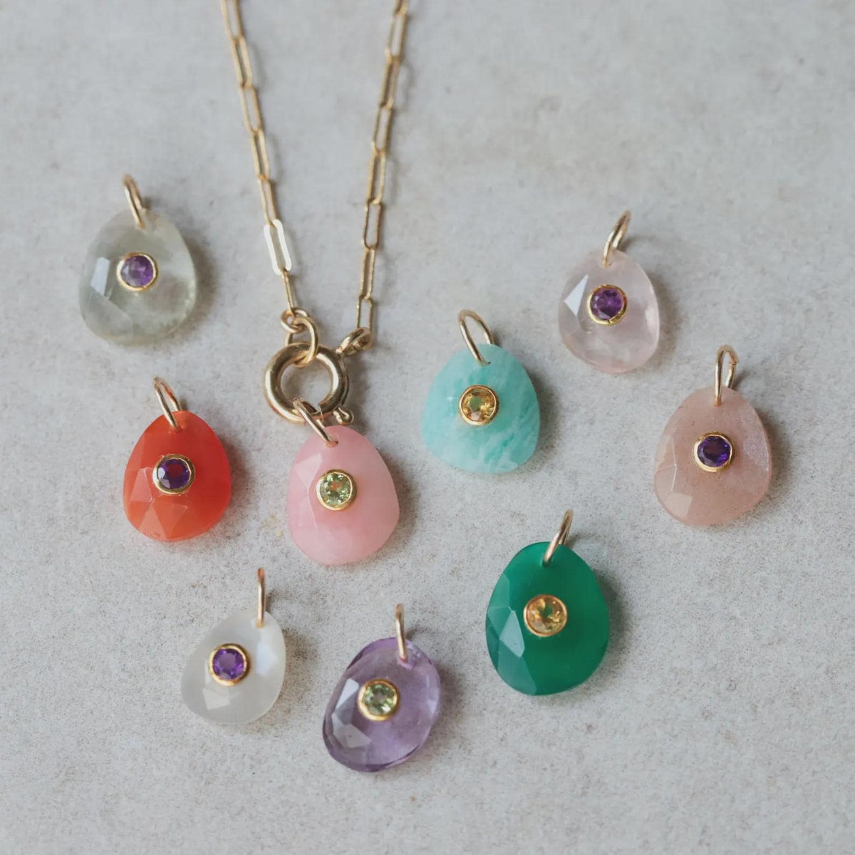 Moonflower pendant featuring moonstone and peridot, handcrafted jewelry with a floral design from Earthly Abundance.