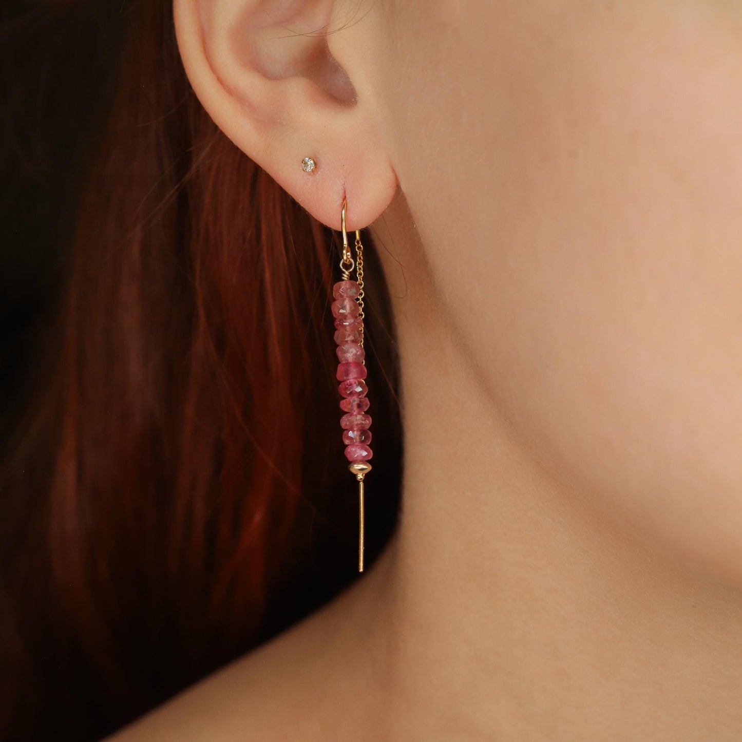 Pink Tourmaline Threader Earrings by Earthly Abundance featuring delicate gold chains and vibrant pink gemstones.