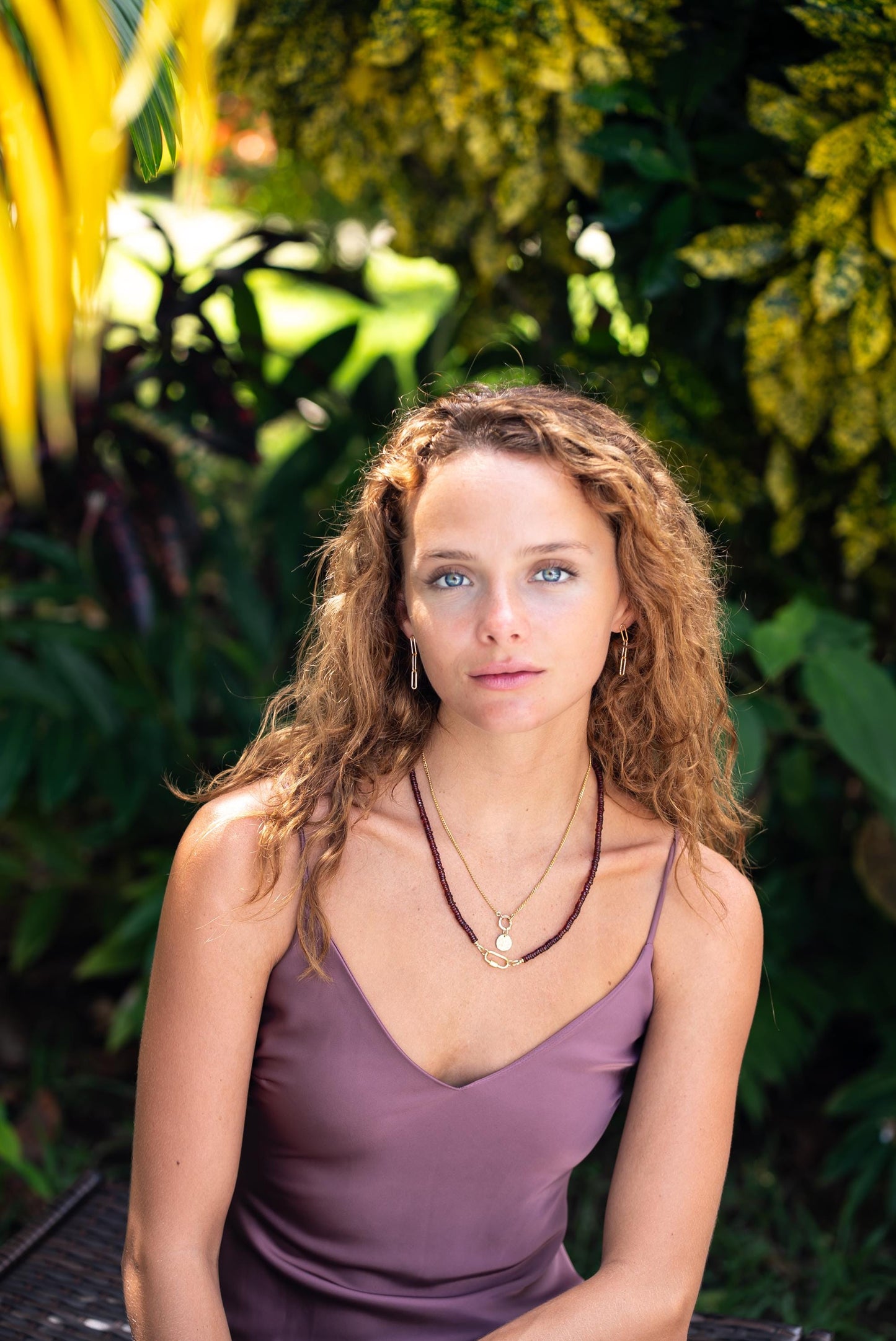 Evil Eye Necklace Set by Earthly Abundance featuring a silver chain with blue and white evil eye pendant.