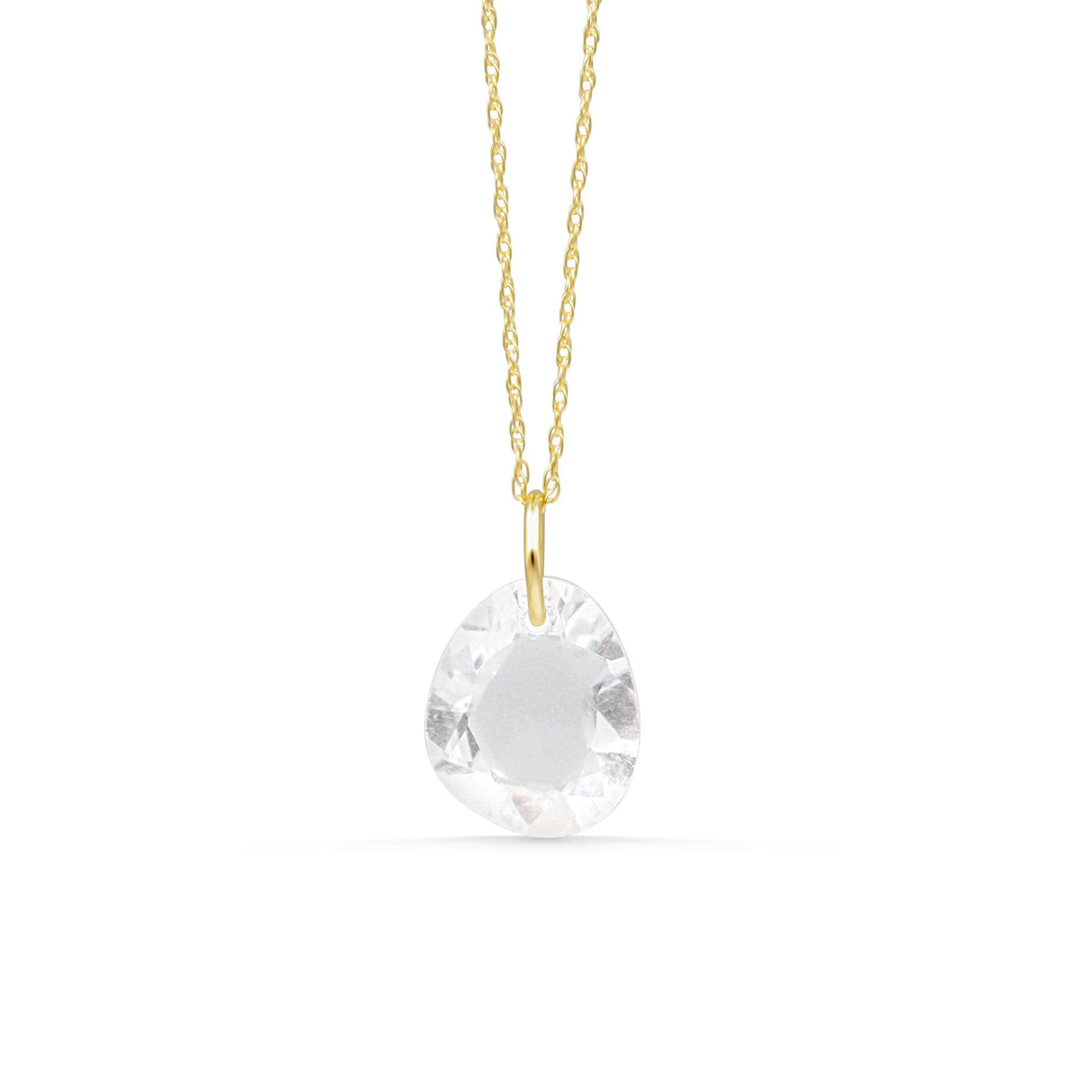Clear quartz pendant necklace with 14k gold setting from Earthly Abundance, featuring a polished, transparent gemstone on a delicate chain.