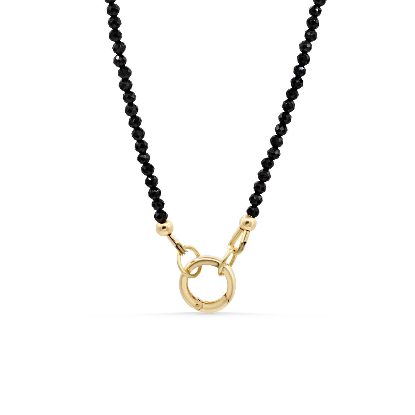 Lore Black Tourmaline necklace with 14K gold chain from Earthly Abundance, featuring a polished black tourmaline pendant.
