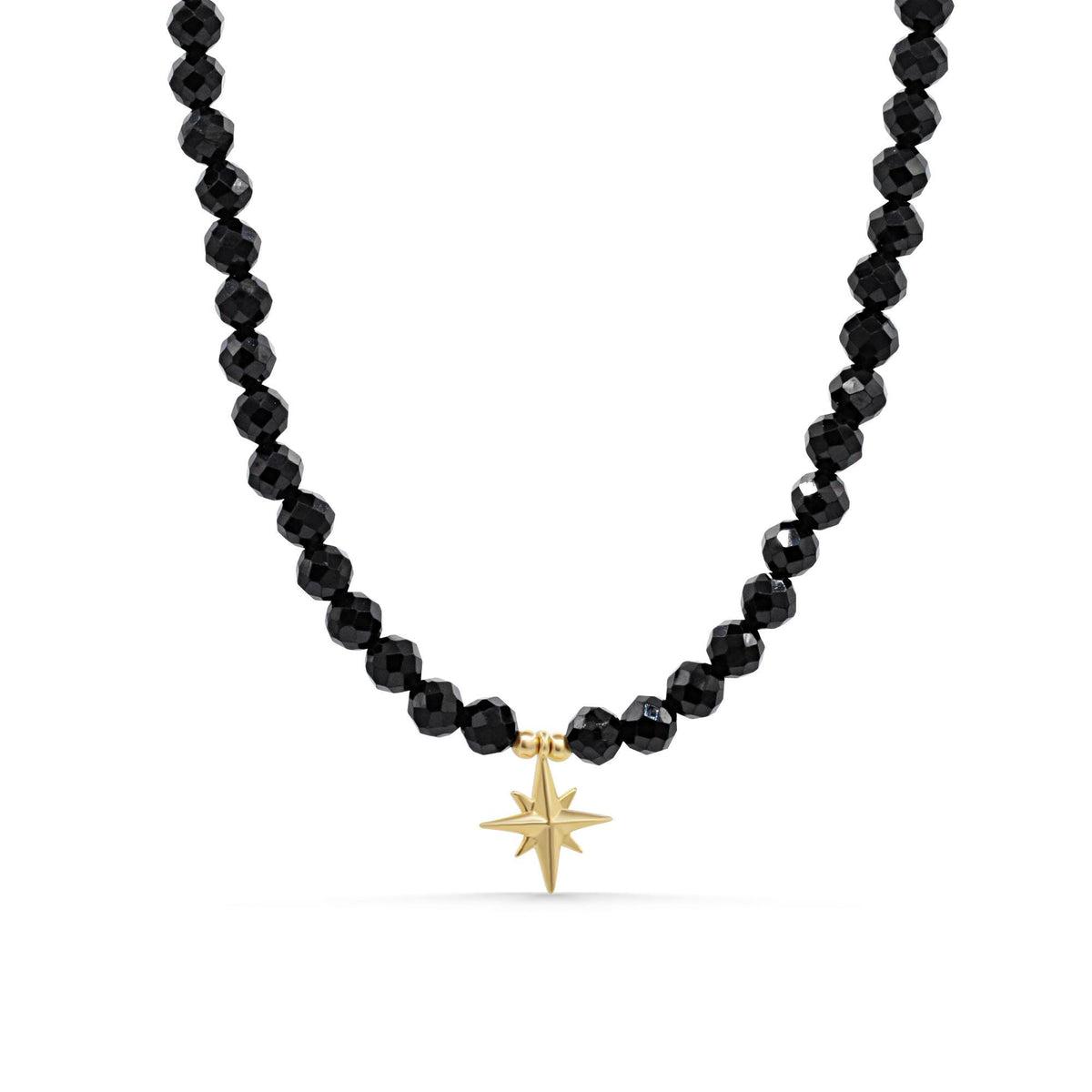 Black Spinel North Star Necklace in 14K gold from Earthly Abundance, featuring a shining star-shaped pendant with black spinel stones.