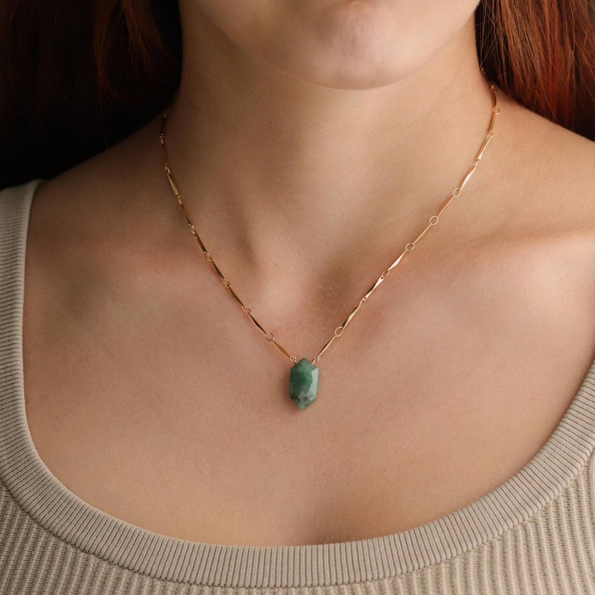 Emerald pendant necklace on 14K gold-filled chain, featuring a vibrant green gemstone, from Earthly Abundance.