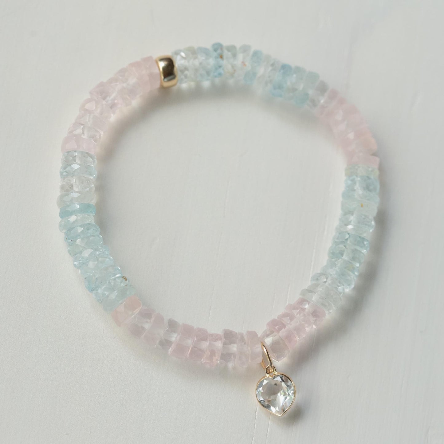 Sweetheart bracelet featuring Morganite, Aquamarine, and White Topaz gemstones, crafted by Earthly Abundance.