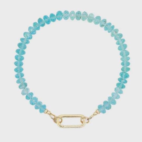14K Apatite bracelet with blue-green stones on a delicate chain, featuring Earthly Abundance branding.