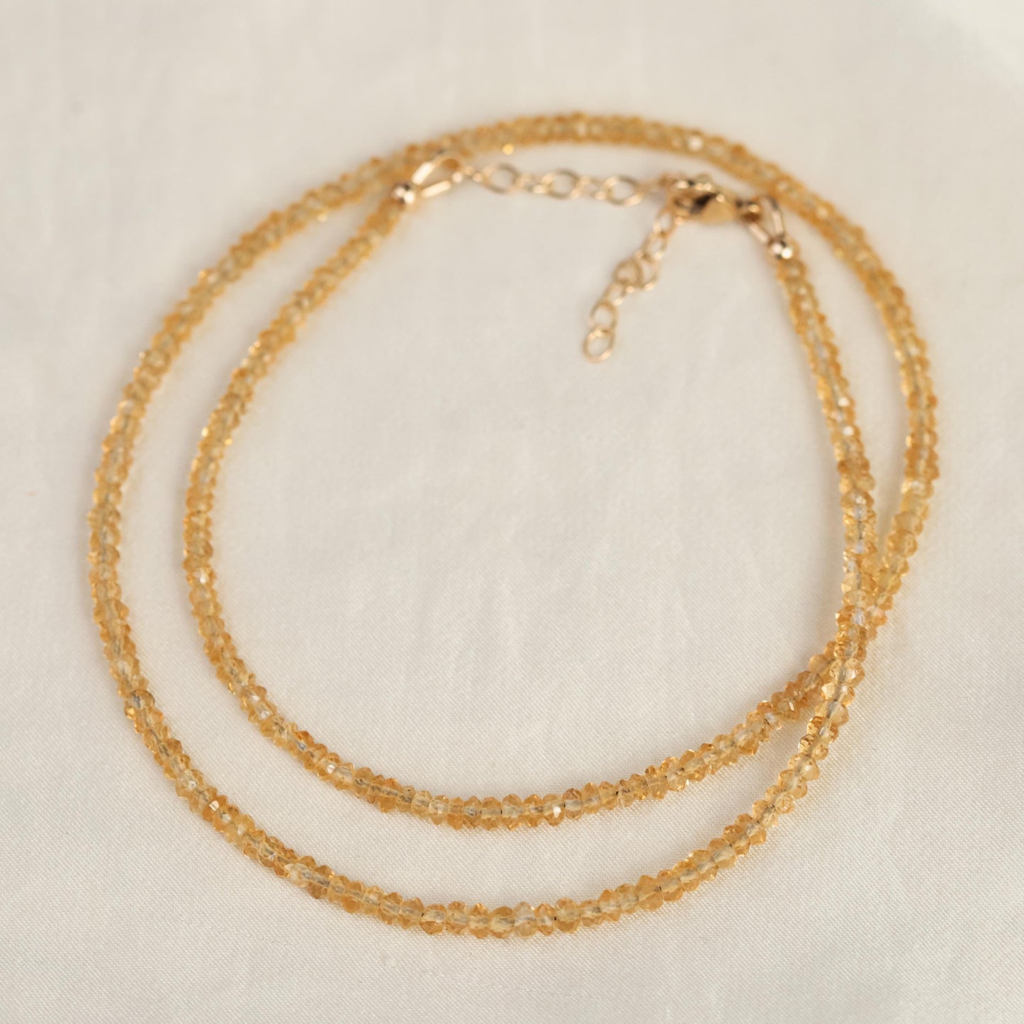 Genuine citrine necklace with 14K gold chain from Earthly Abundance, showcasing a vibrant yellow citrine pendant.