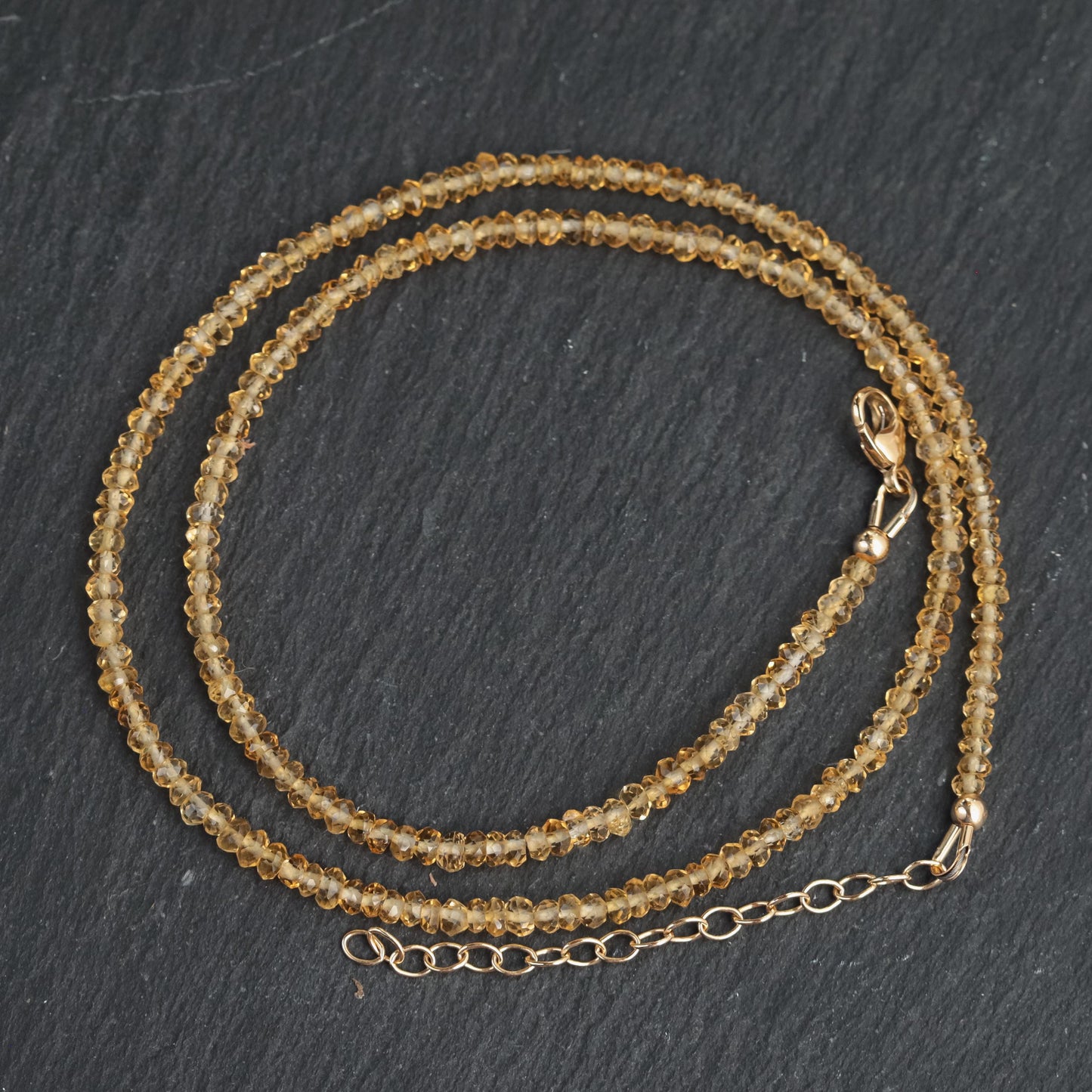 Genuine citrine necklace with 14K gold chain from Earthly Abundance, featuring a large yellow gemstone pendant.