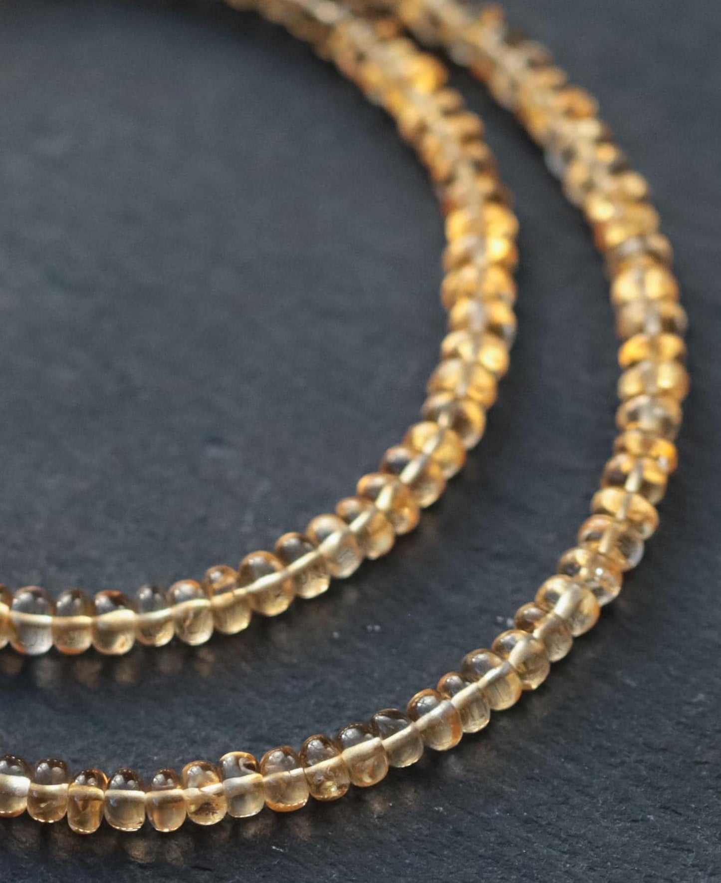 Amber Glow Citrine Necklace by Earthly Abundance featuring a large, polished citrine pendant on a delicate chain.