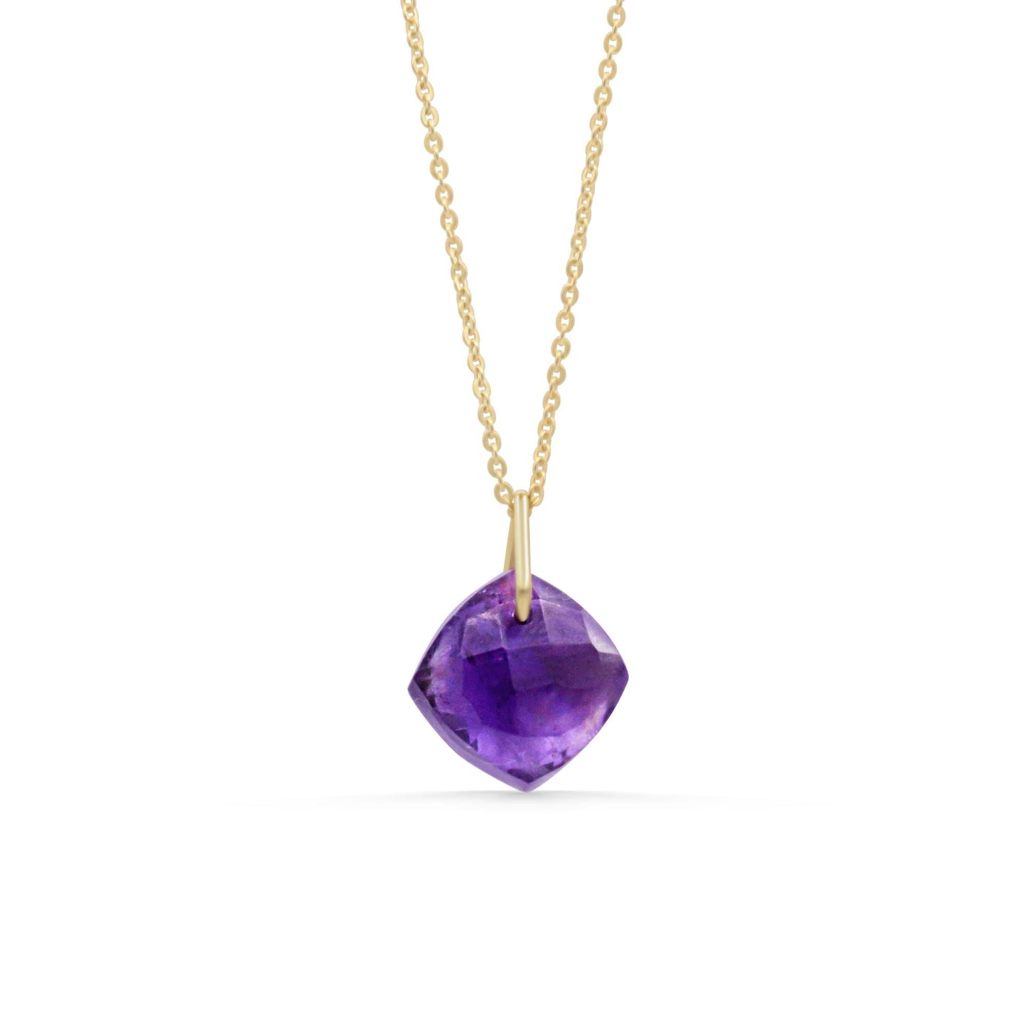 Rich violet amethyst pendant necklace featuring a polished gemstone on a silver chain, styled for elegant wear.