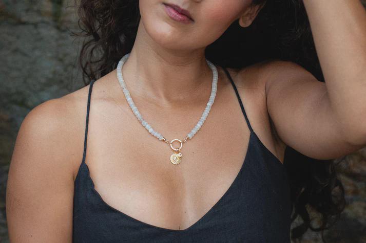 Driftlight Moonstone Necklace by Earthly Abundance featuring a polished moonstone pendant on a delicate chain.