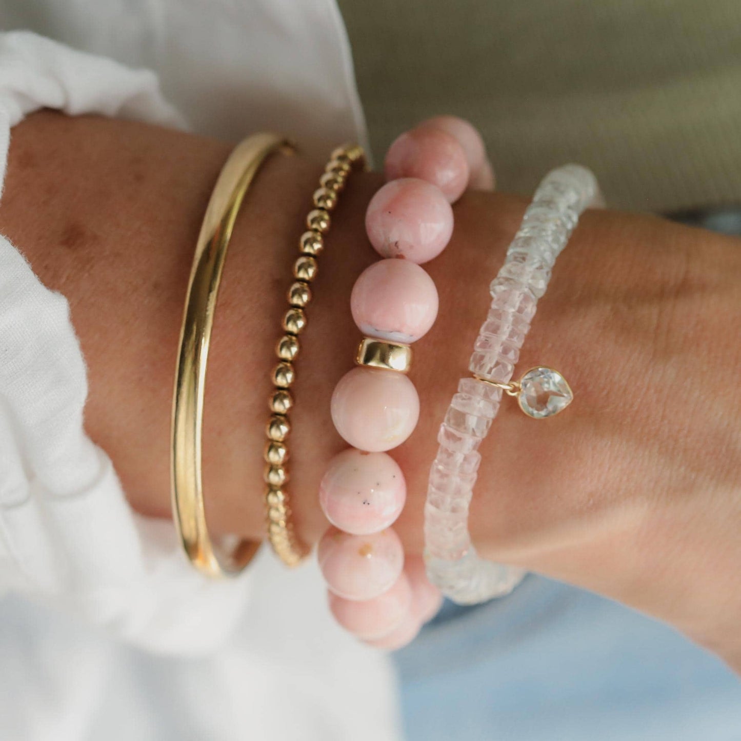 Pink Opal bracelet with 12mm beads featuring 14K gold accents, crafted by Earthly Abundance.