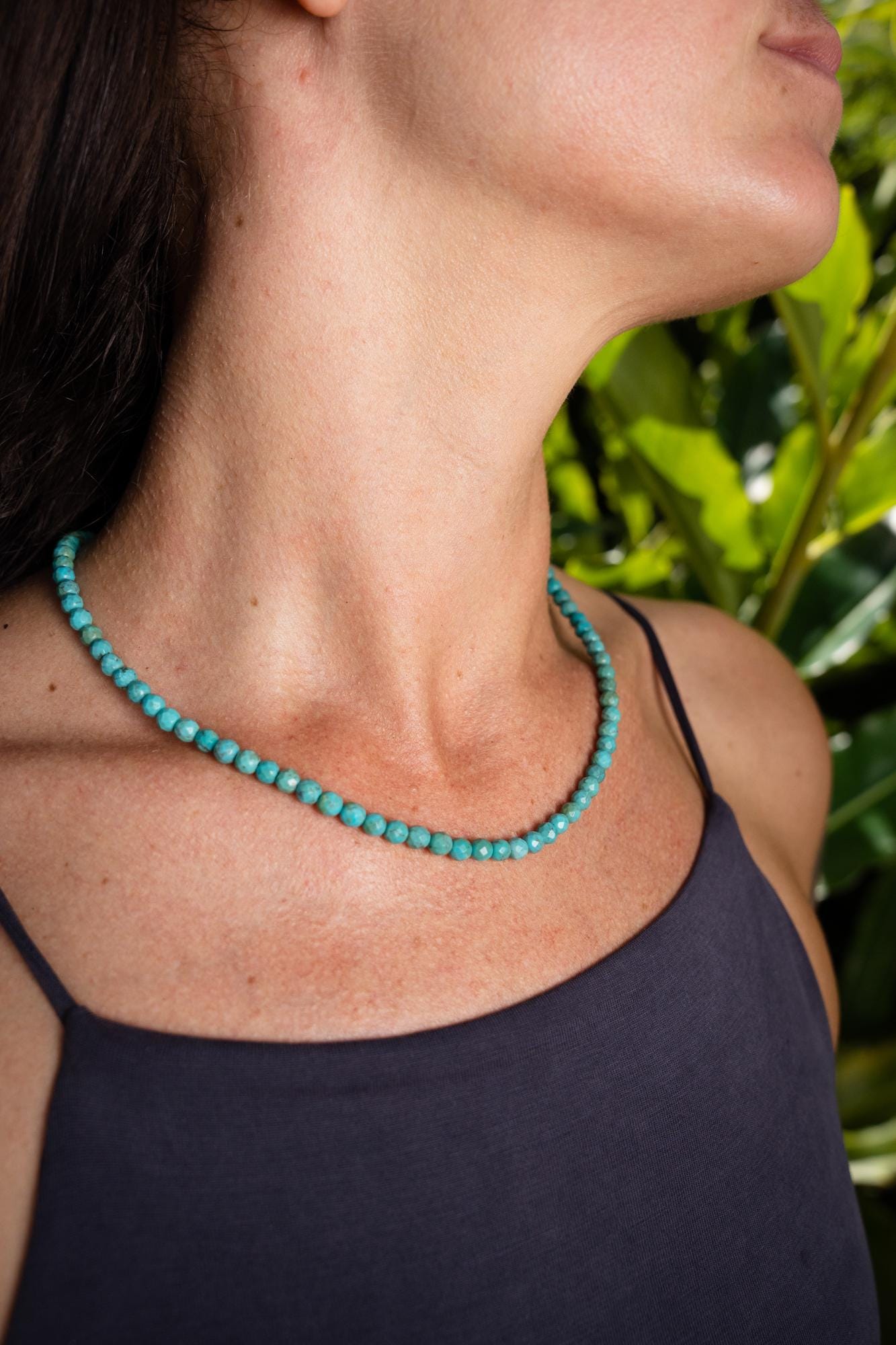 Desert Sky Turquoise Necklace by Earthly Abundance featuring a vibrant turquoise pendant on a beaded chain.