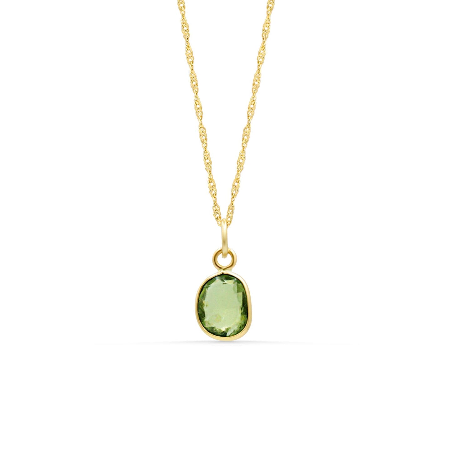 Lime Light Peridot necklace by Earthly Abundance featuring a vibrant green peridot pendant on a delicate chain.