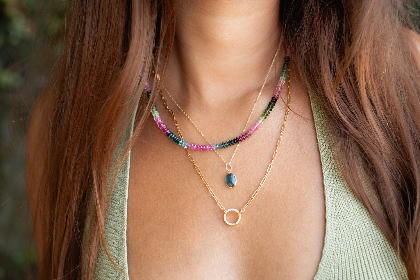 Azure Horizon Moss Kyanite necklace with 14K gold chain from Earthly Abundance, featuring a polished blue-green kyanite pendant.