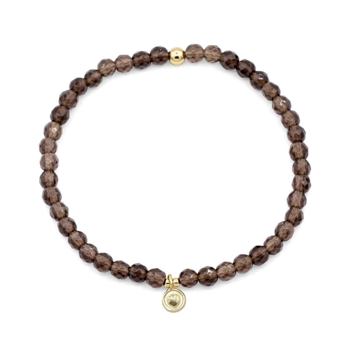 Smoky Quartz bracelet by Earthly Abundance featuring dark, polished smoky quartz beads on an elastic band.