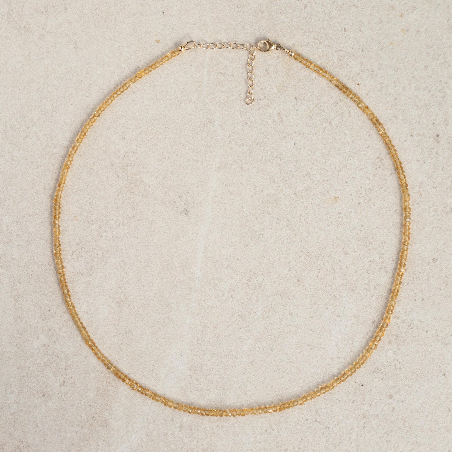 Genuine yellow citrine necklace with 14K gold chain from Earthly Abundance, featuring a polished citrine pendant.