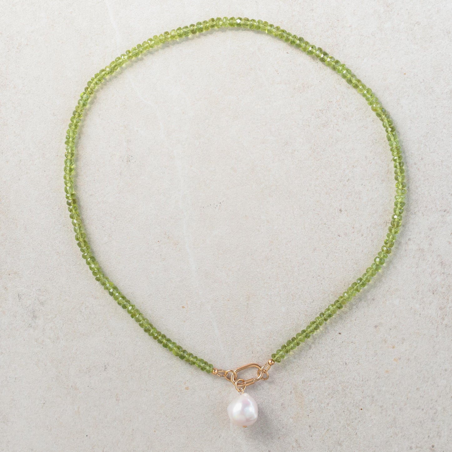 Peridot and pearl carabiner necklace featuring green gemstones and white pearls, from Earthly Abundance.