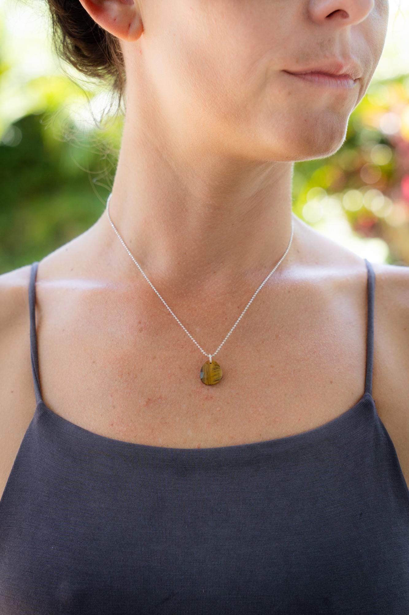 Sterling silver Tiger's Eye ball chain necklace with round beads, featuring a polished, natural gemstone pendant.