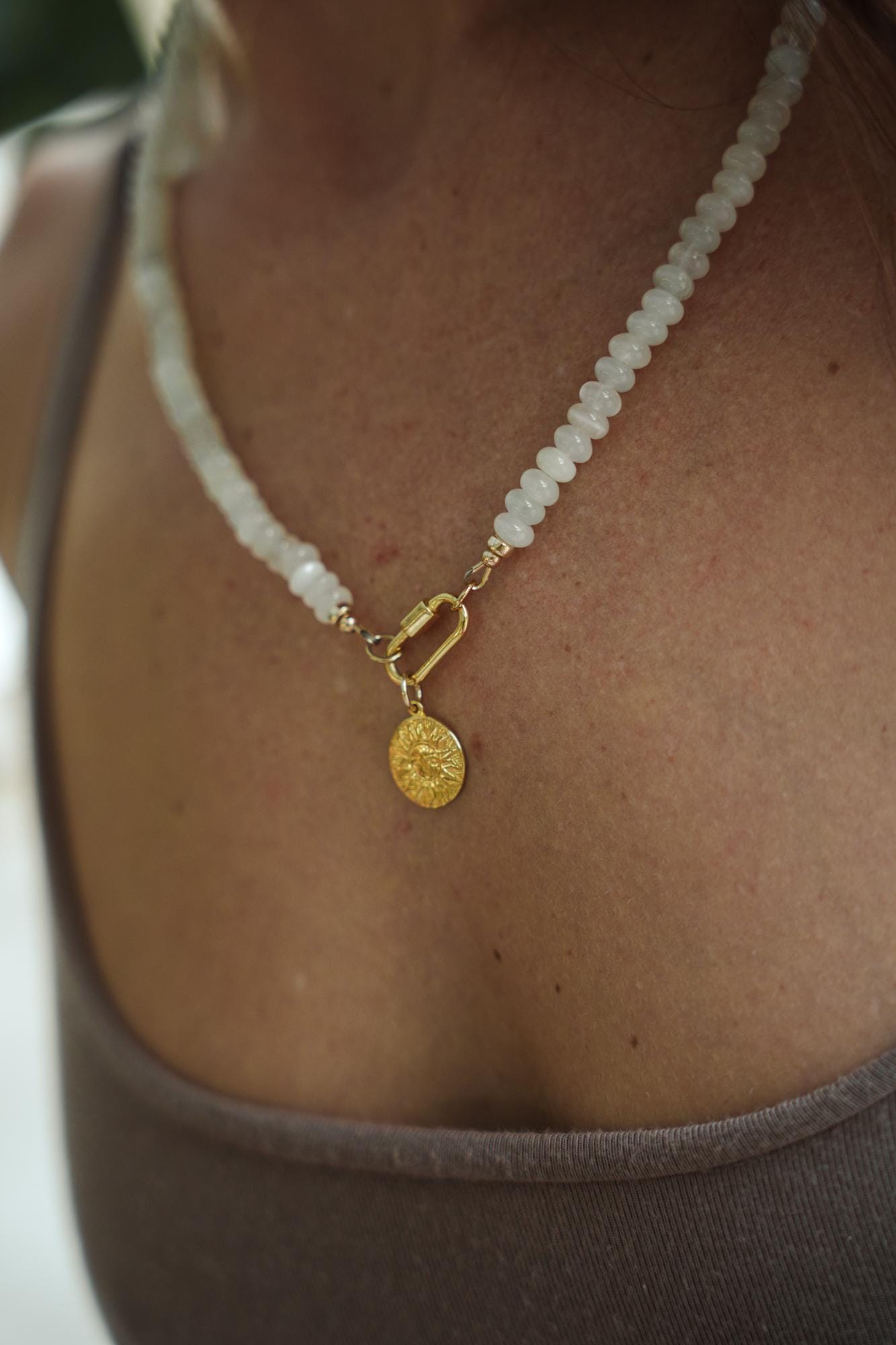 Luna Sol Moonstone Carabiner Necklace by Earthly Abundance featuring a moonstone pendant on a silver chain.