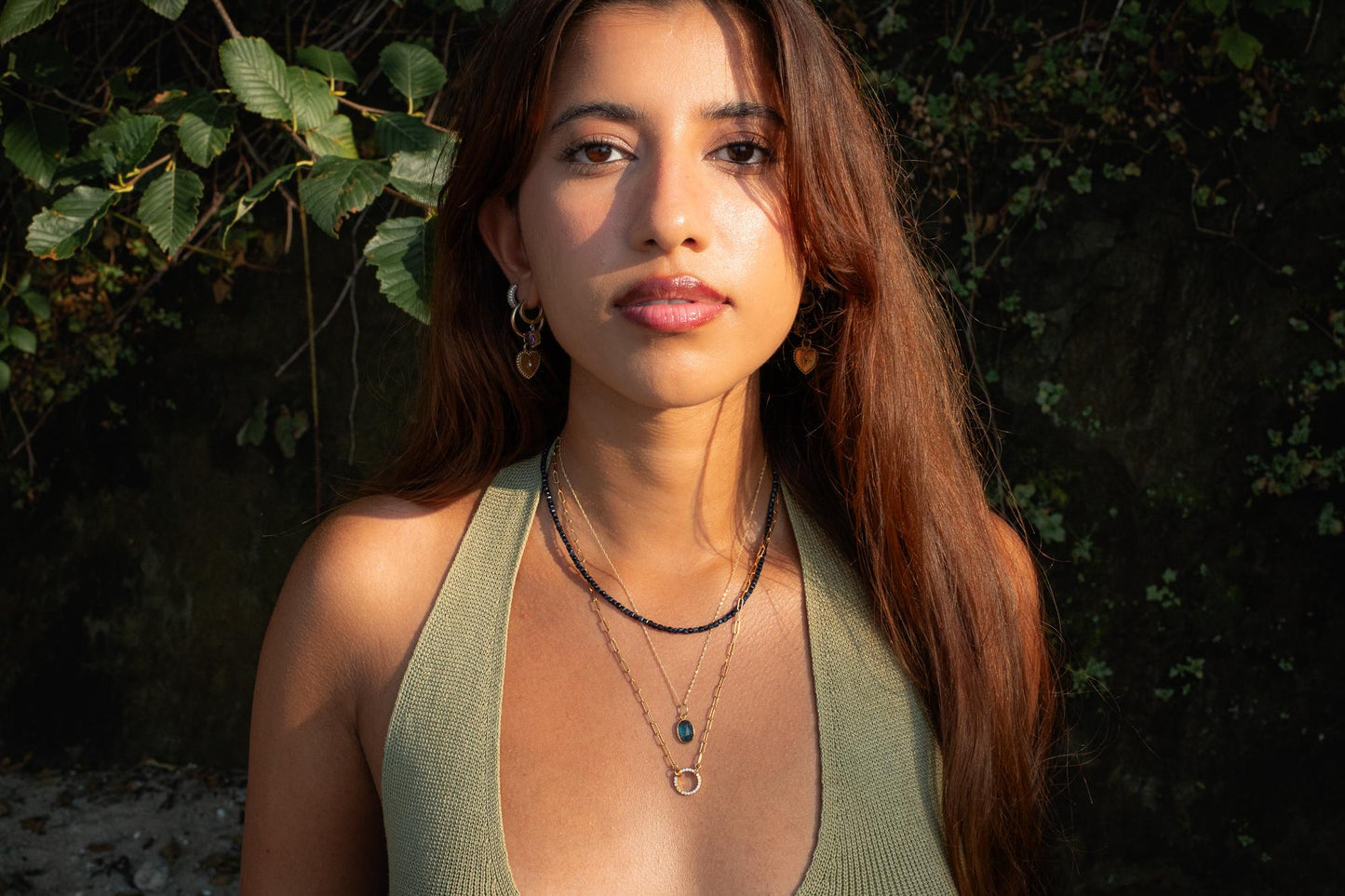 Azure Horizon Moss Kyanite necklace with 14K gold chain from Earthly Abundance, featuring a polished blue-green gemstone pendant.