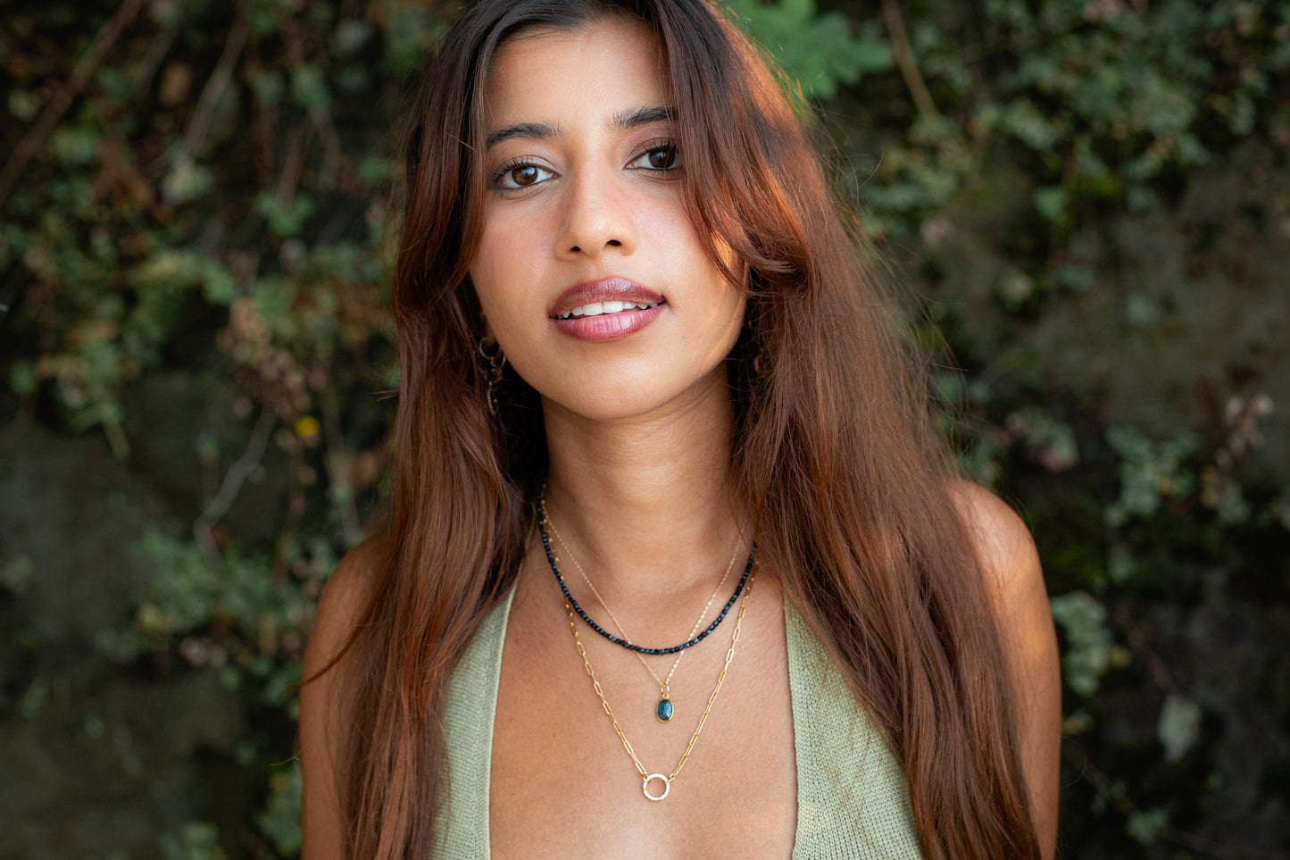 Azure Horizon Moss Kyanite necklace with 14K gold chain from Earthly Abundance, featuring a vibrant blue-green pendant.