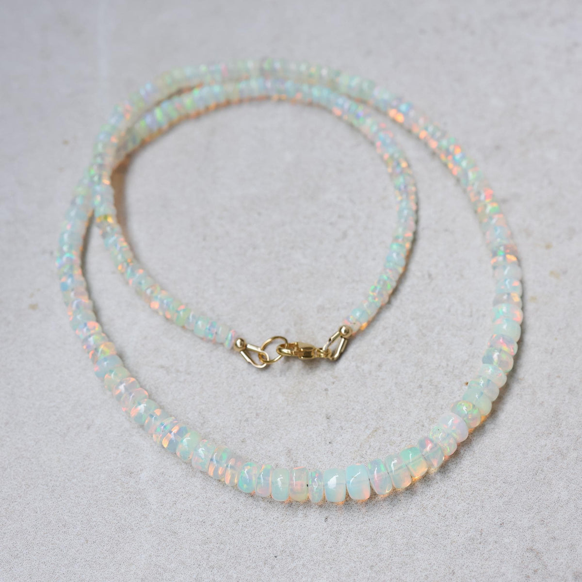 Smooth Rondel Ethiopian Opal Necklace featuring polished oval Ethiopian opal beads on a delicate chain.