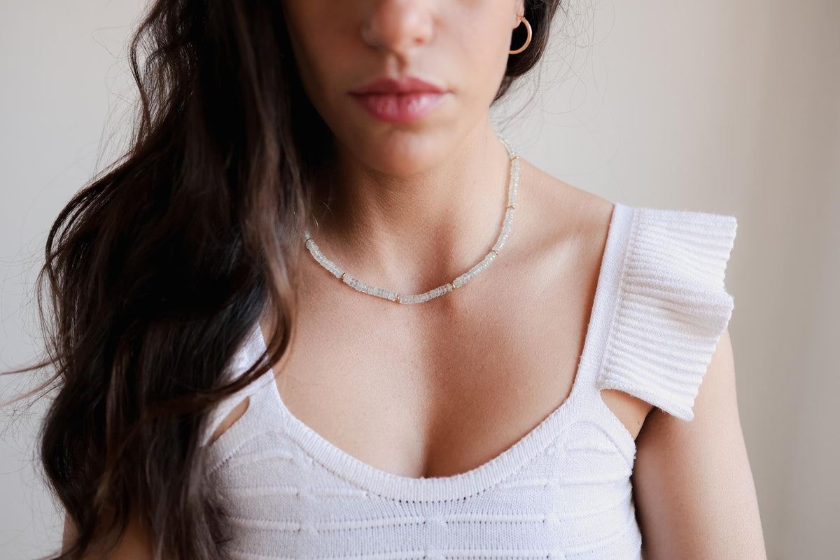 Blue Topaz Heishi necklace from Earthly Abundance featuring small, round blue topaz beads strung together in a delicate design.