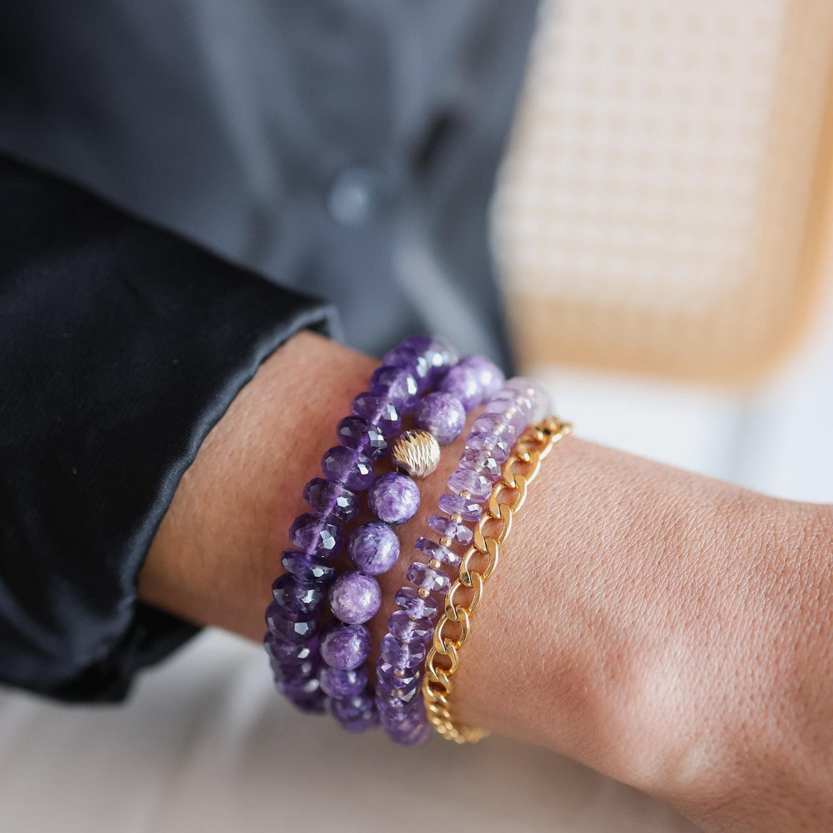 Earthly Abundance 8mm Charoite bracelet featuring polished purple gemstone beads on an elastic band.