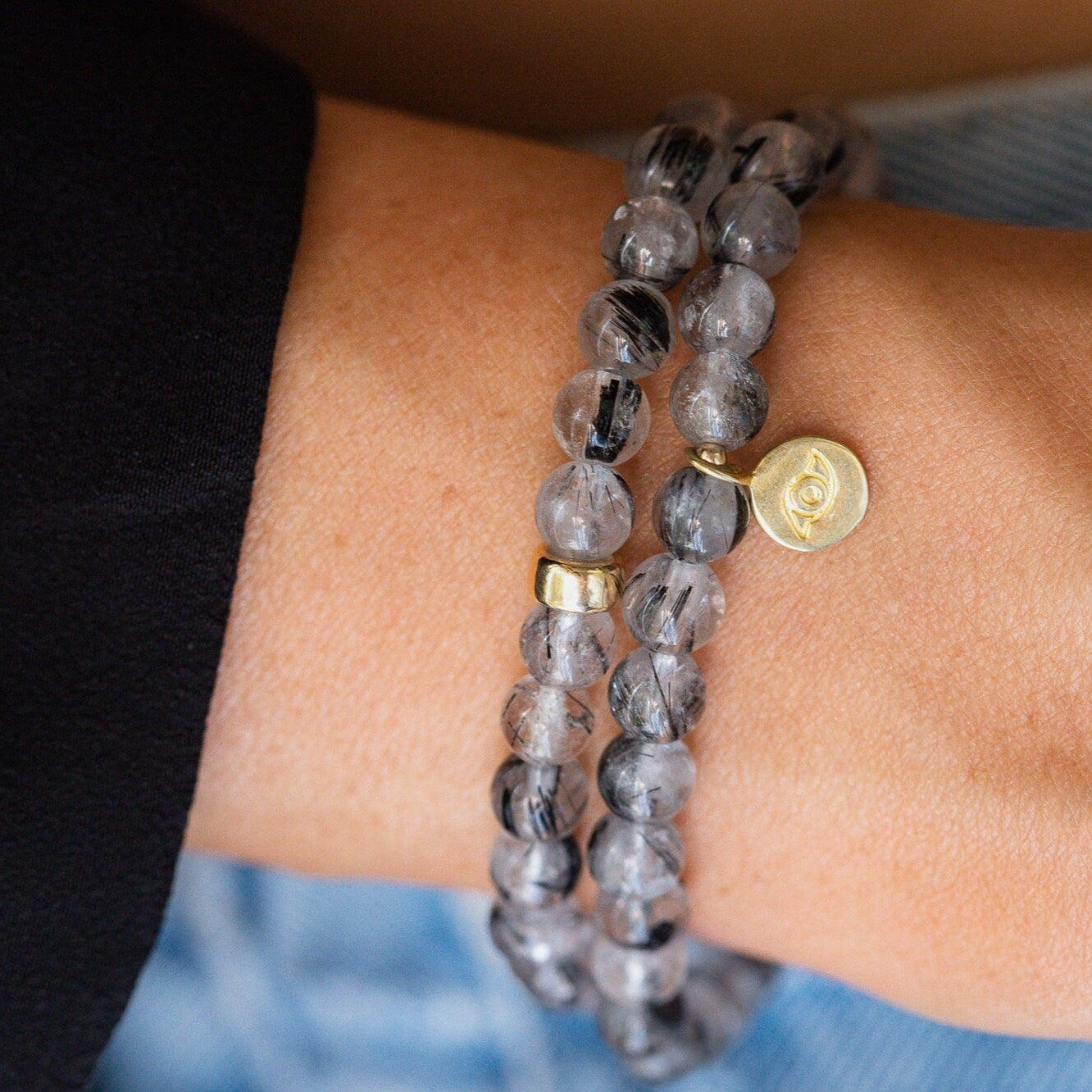 Black rutilated quartz with evil eye charm