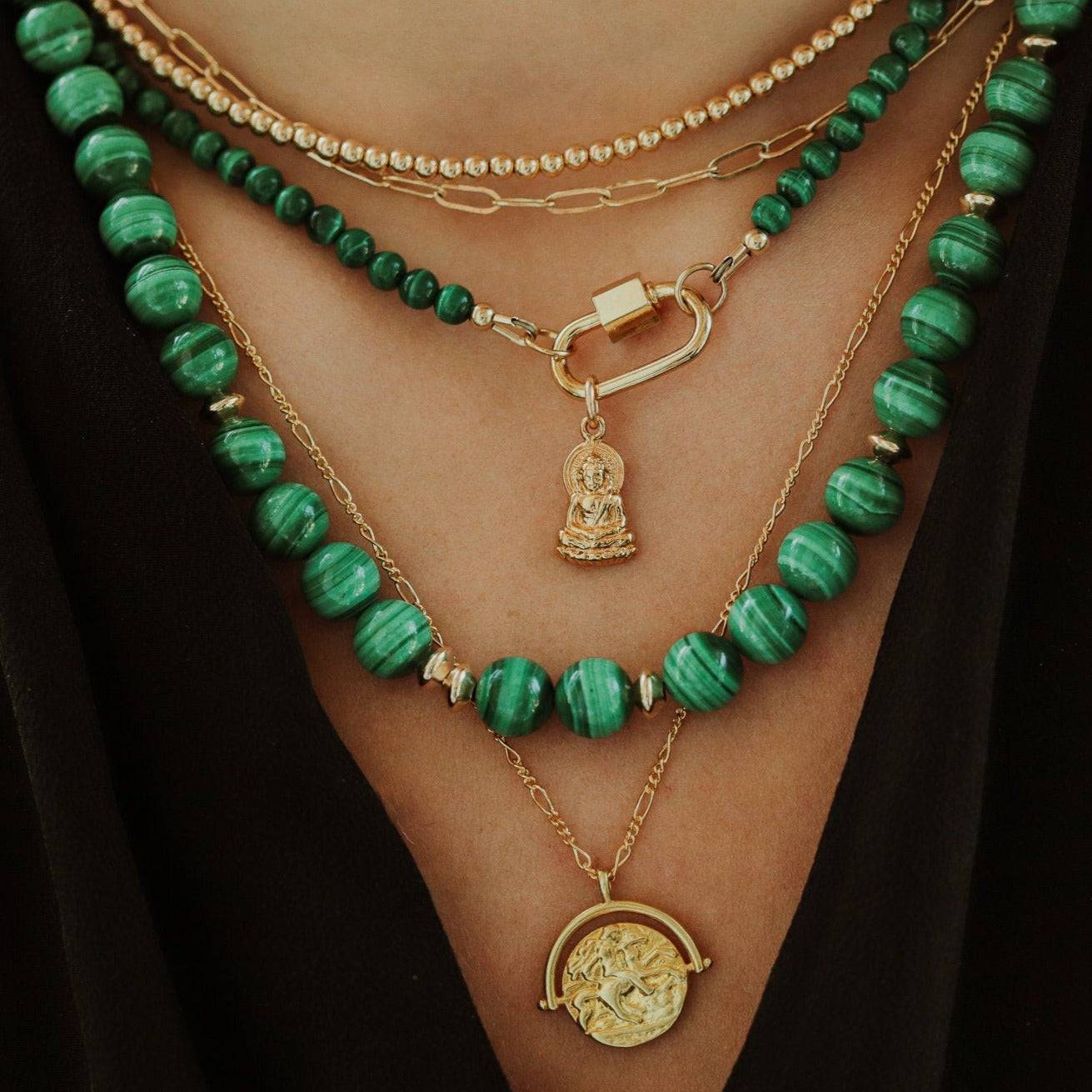 Earthly Abundance Jewelry Malachite power necklace featuring a vibrant green malachite pendant on a silver chain.