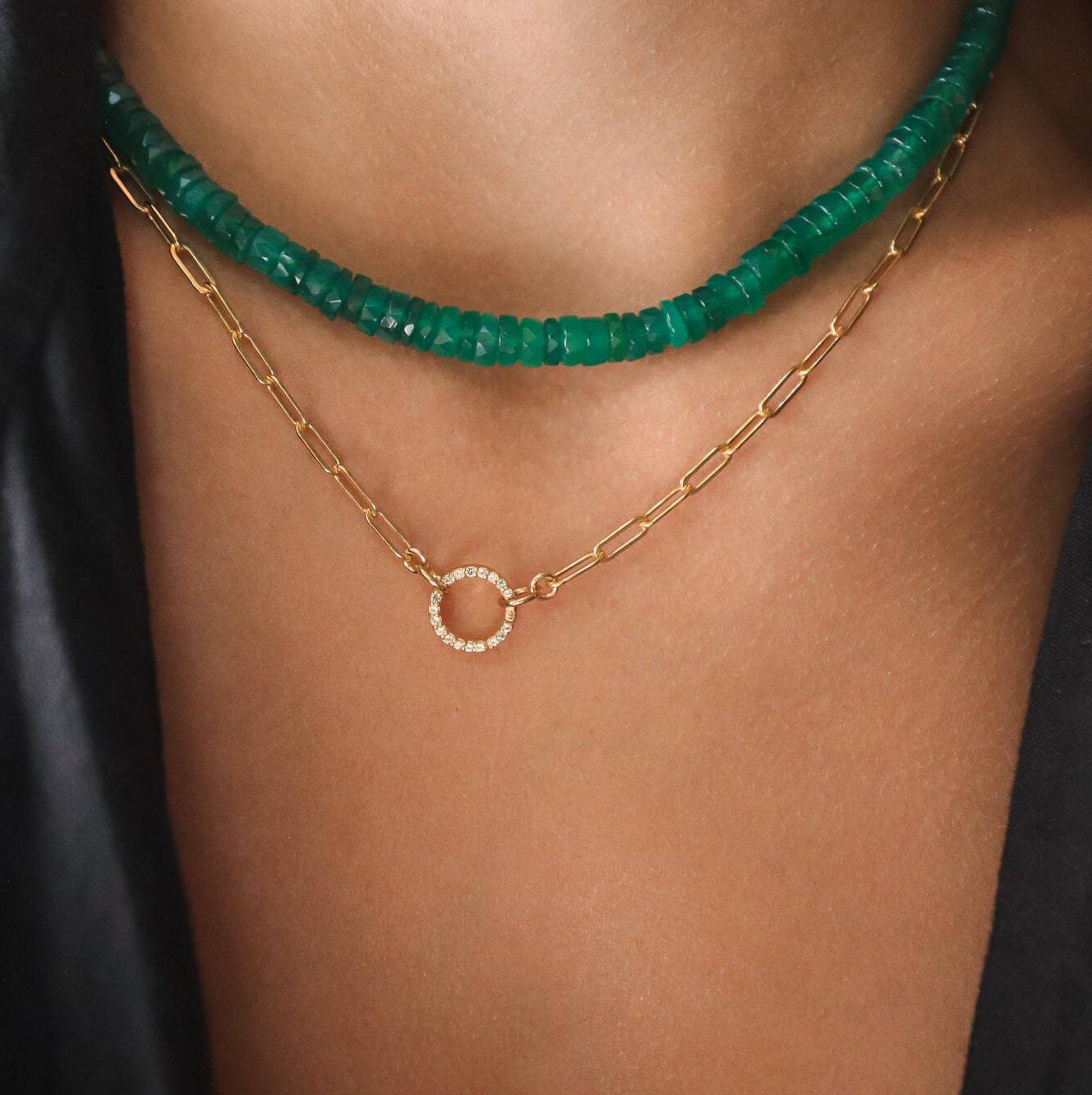 Green onyx heishi necklace featuring smooth, round green onyx beads strung on a delicate cord, styled for a natural look.