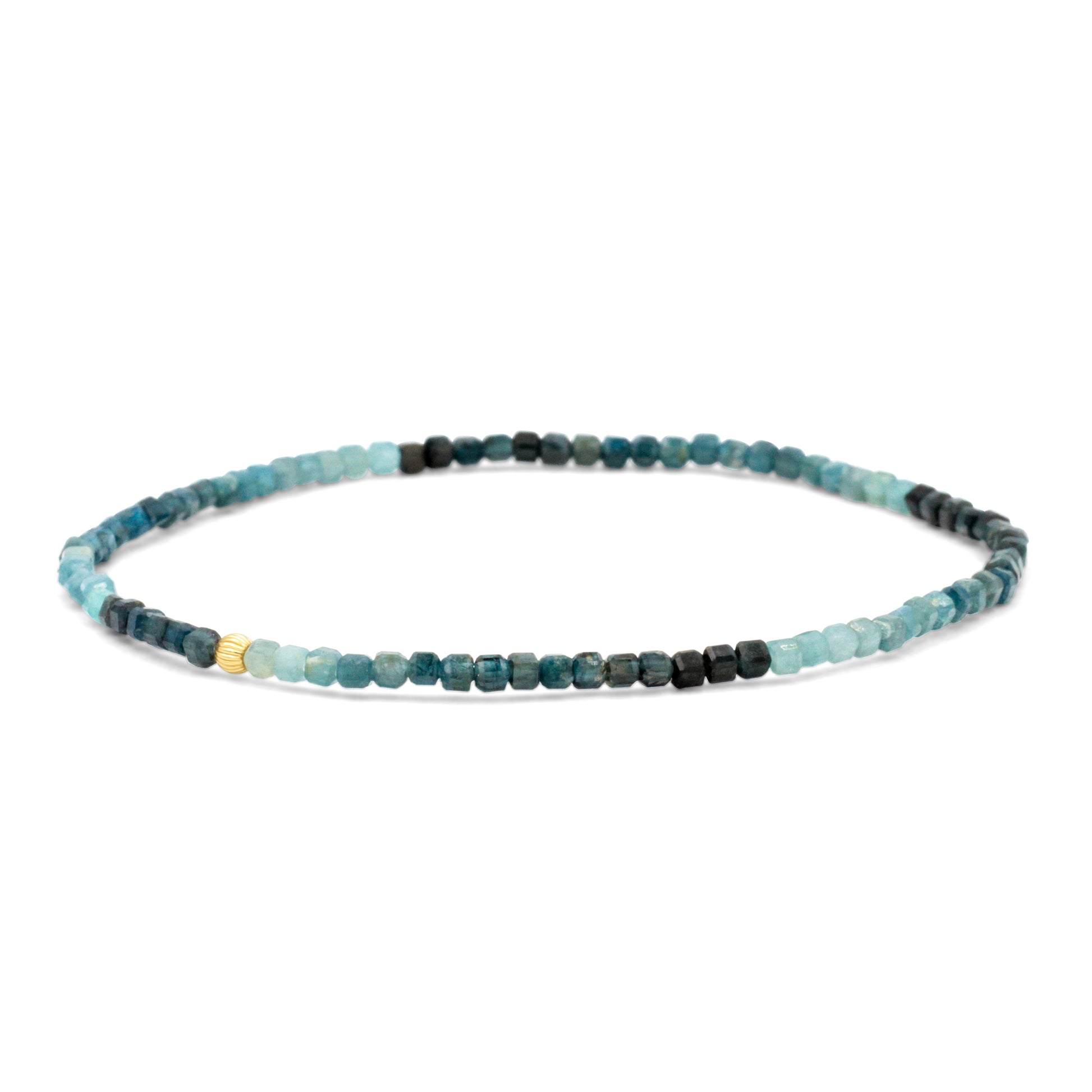 Earthly Abundance Grandidierite cube bracelet featuring blue gemstone cubes on a delicate silver chain.
