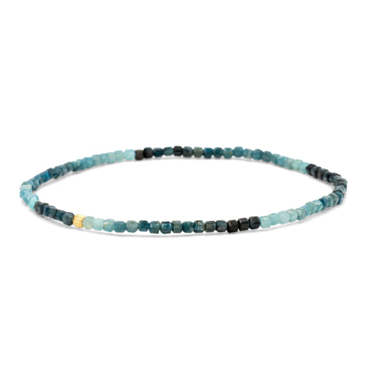Earthly Abundance Grandidierite cube bracelet featuring blue gemstone cubes on a delicate silver chain.
