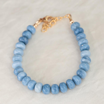 Blue Opal bracelet by Earthly Abundance featuring polished blue opal beads on a delicate elastic cord.