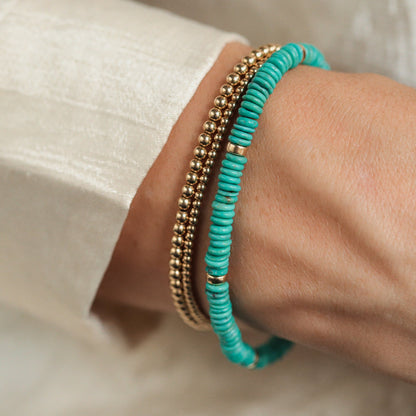 Earthly Abundance Kingman turquoise accents in 14K gold-filled jewelry, featuring vibrant turquoise stones and gold detailing.
