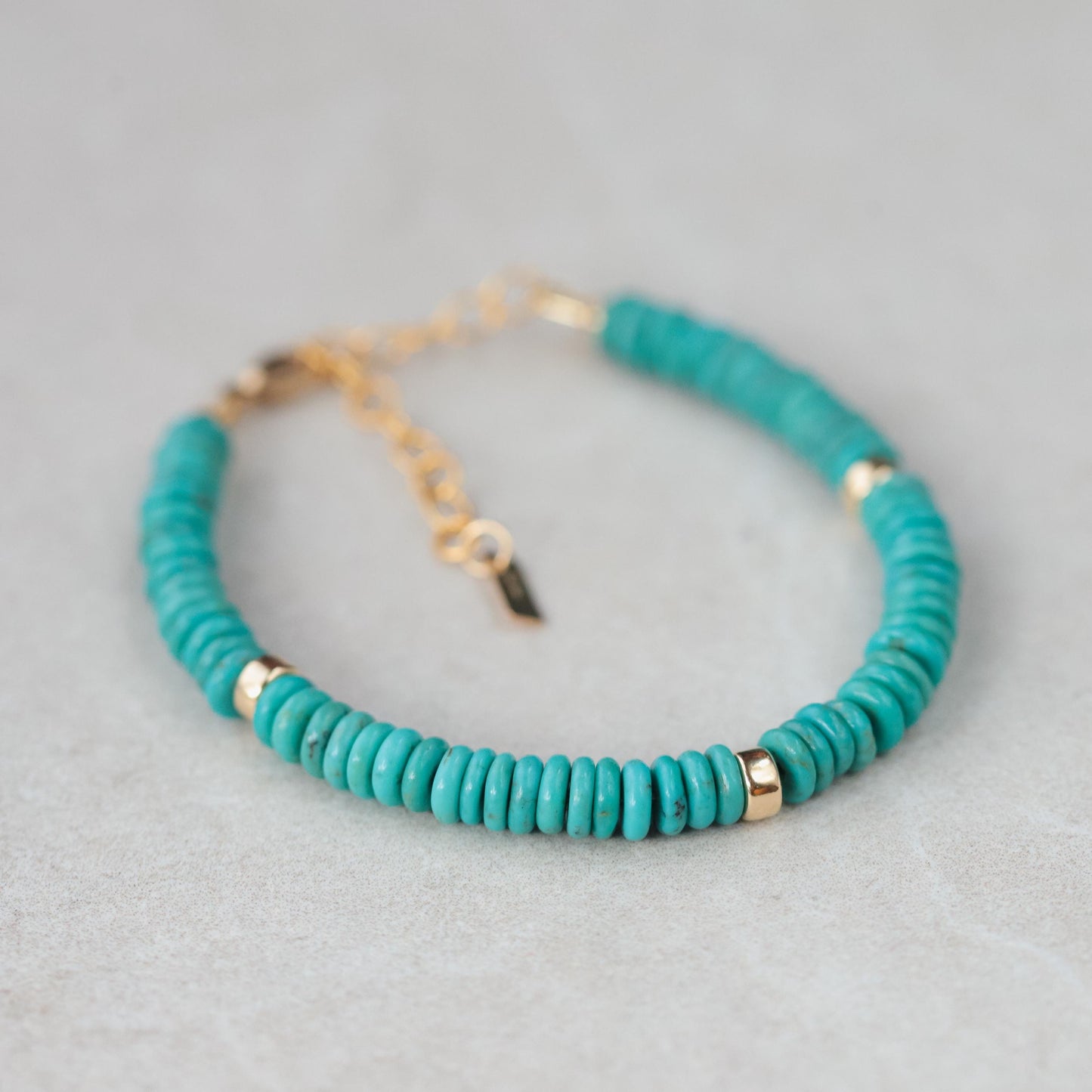 Earthly Abundance Kingman turquoise accents on 14K gold-filled jewelry, featuring vibrant turquoise stones and gold detailing.