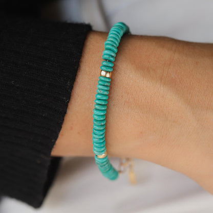 Close-up of Kingman turquoise accents in 14K gold filled jewelry, showcasing vibrant turquoise stones and gold detailing.