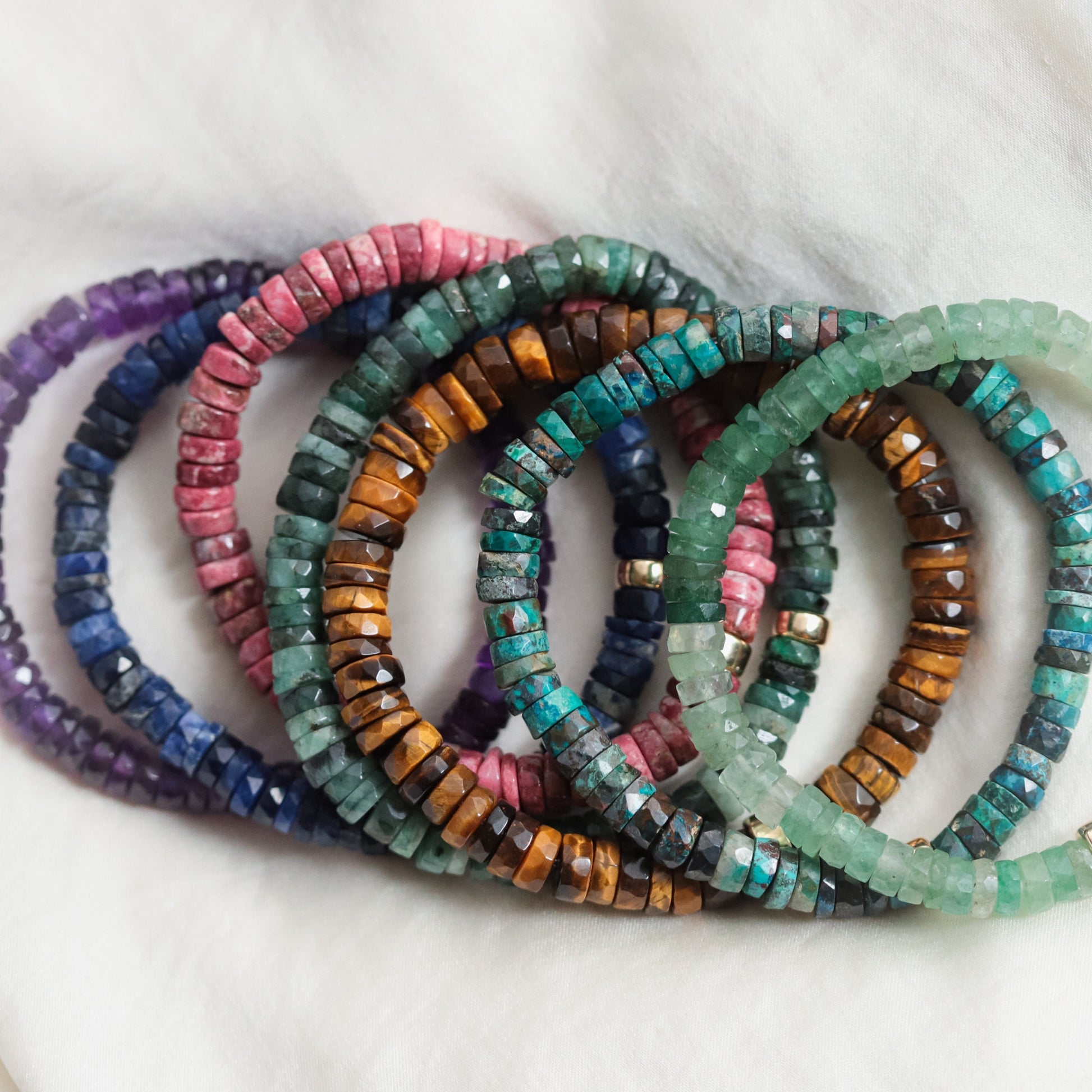 Tiger's Eye heishi bracelet by Earthly Abundance featuring smooth, round beads on an elastic stretch band.
