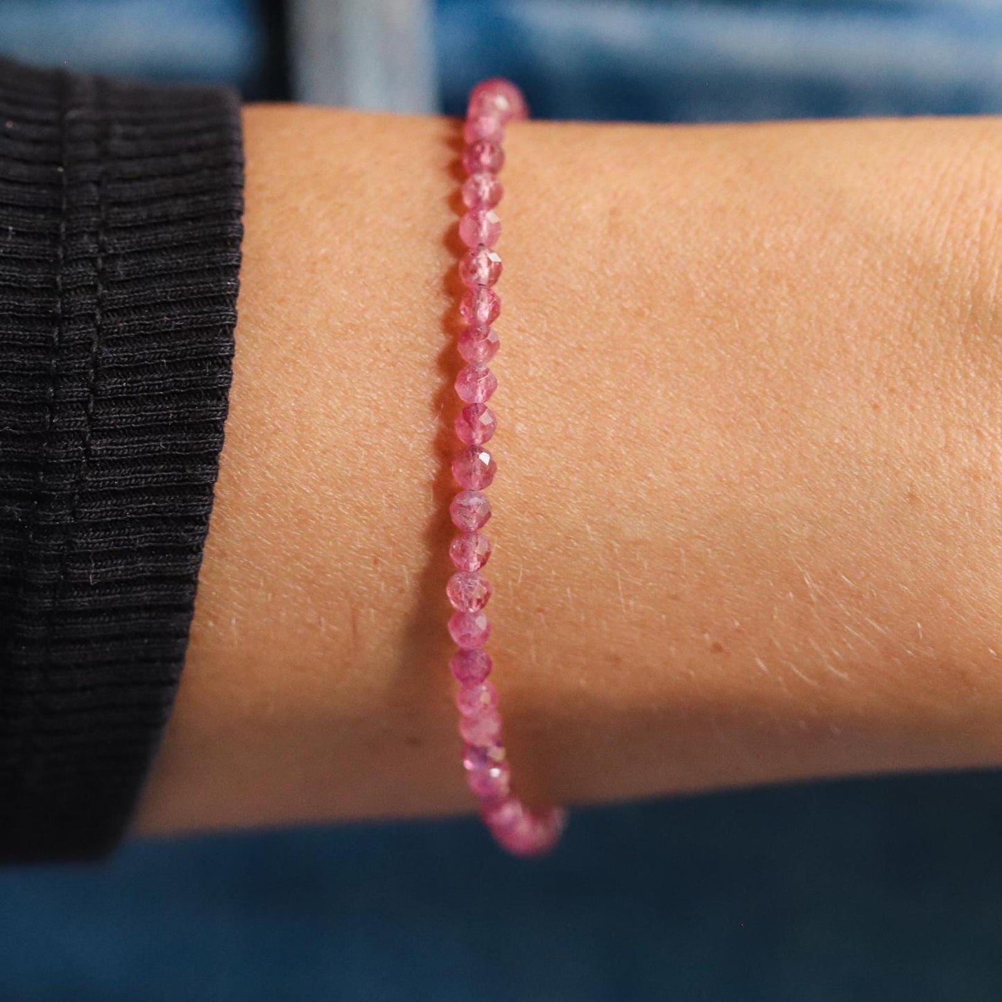 Pink tourmaline gemstone in 14K gold setting by Earthly Abundance, showcasing a vibrant pink stone with gold accents.