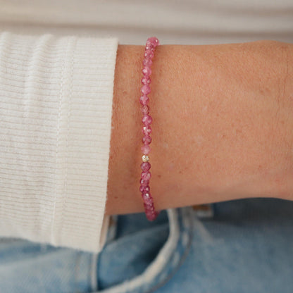 Pink 14K gold ring featuring a vibrant pink tourmaline gemstone from Earthly Abundance.