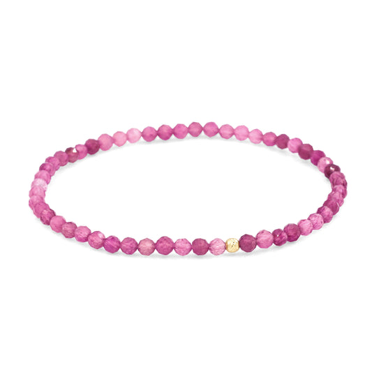 14K pink tourmaline pendant from Earthly Abundance featuring a vibrant pink gemstone set in a delicate gold setting.