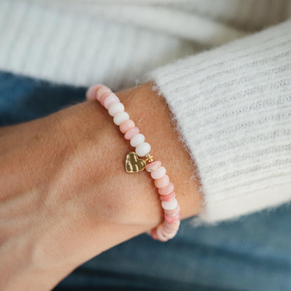 Pink Opal heart bracelet from Earthly Abundance featuring a delicate pink gemstone heart on a silver chain.