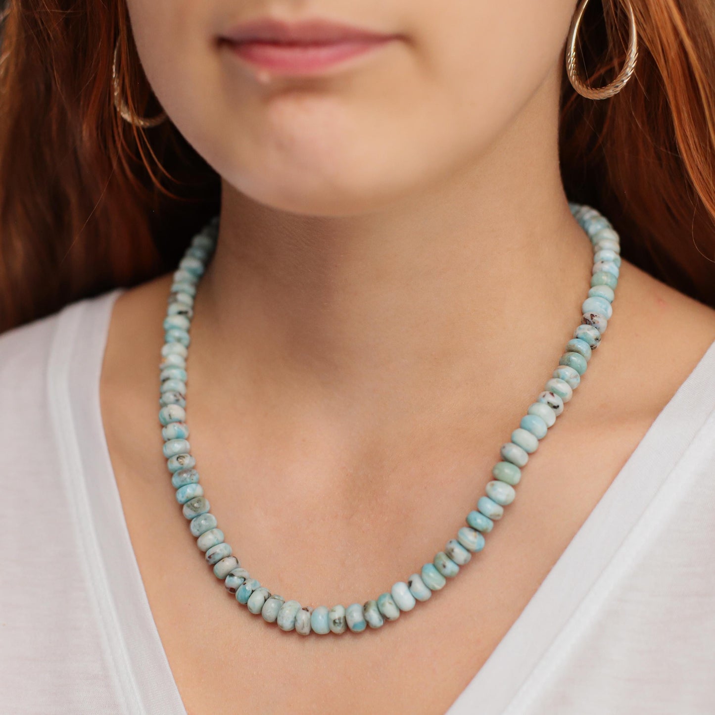 Candy Larimar necklace featuring a polished blue Larimar pendant on a silver chain, styled with a boho jewelry aesthetic.